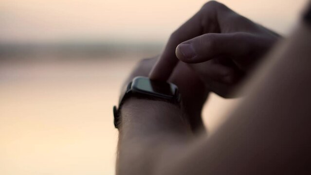 checking heart rate on smartwatch . measuring pulse on smart watch . fitness gadget