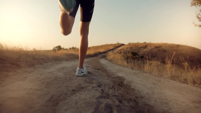 man in sportswear jogging, exercising, and sprinting as part of triathlon	