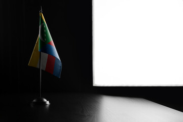 Small national flag of the Comoros on a black background