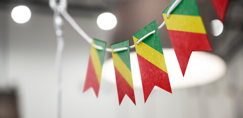 A garland of Congo national flags on an abstract blurred background