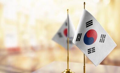 Small flags of the South Korean on an abstract blurry background