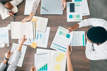 Collaboration, documents and financial with a business team working together in an accounting office from above. Meeting, data and finance planning with a man and woman accountant group at work