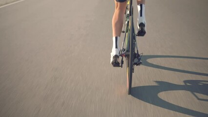 cycling on bicycle. athlete pedaling on bicycle . strong legs