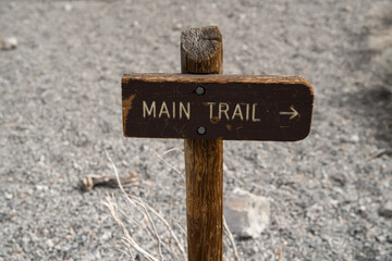 Main trail sign with arrow.