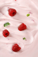 Texture, background of Pink Yogurt with  raspberries. Curl of Yogurt. Pink nature yogurt, sour cream, ice cream.