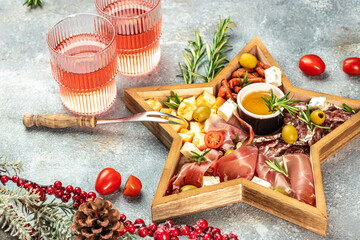 Assorted cheeses and deli meat appetizers. Festive Appetizer for christmas table. place for text,...