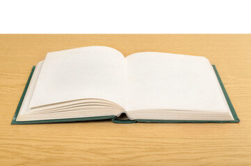 Open book on wooden desk. Education concept