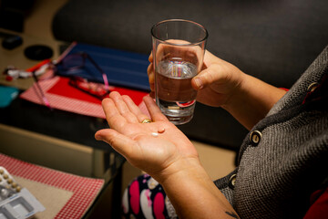 Senior person counting pills, afraid of running out of medicine in germany due to lack of supplies