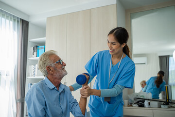 Obraz premium Doctor or nurse caregiver exercise with senior man,Medical Consultant,Nurses rehab exercises and take care senior disabled man.