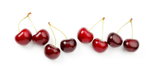 A row of ripe red cherries with stalks on a white background.