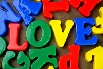 Set of colorful plastic alphabets isolated on background.