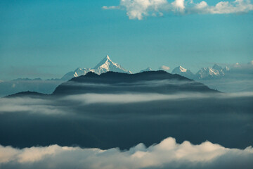 Himalayas with layers of clouds  and fog