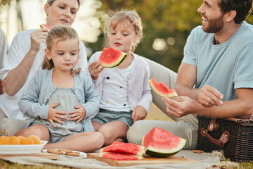 Park, picnic and couple with children and fruit on blanket in garden for happy summer family time...