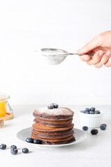 Concept of sweet food, tasty chocolate pancakes