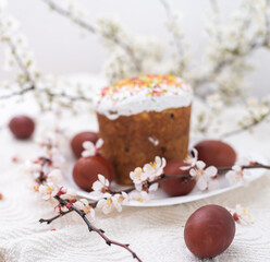 Easter cake and painted eggs blooming branch