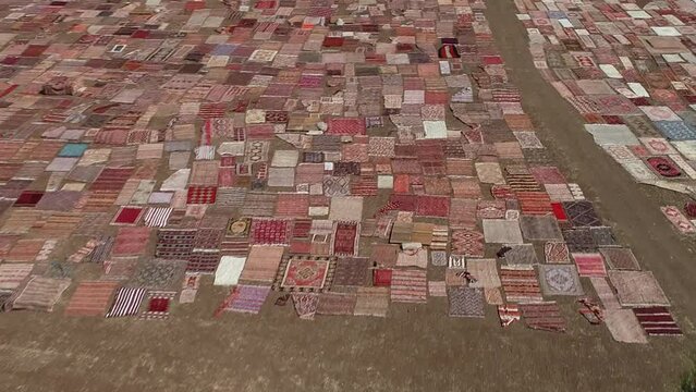 The plot where patterned and colored carpets are left to dry.