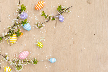 Colorful Easter eggs with spring blossom flowers. Colored Egg Holiday border.