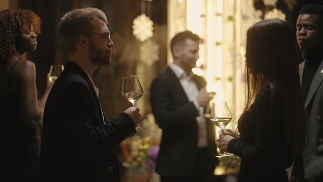 stylish and fashionable people resting in luxury party in evening in restaurant, multi ethnic people