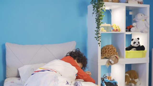 Sleepwalker boy. Sleeping sickness.
The sleepwalking boy gets up from his bed and starts walking around his room.
