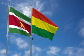 Republic of Suriname and Plurinational State of Bolivia Flags Over Blue Sky Background. 3D Illustration