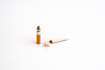 Broken cigarette on white background , World No Tobacco Day Tobacco and lung health concept .