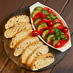 grilled zucchini and sweet peppers and white bread. light snacks. buffet