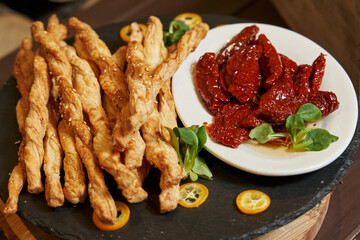 sun-dried tomatoes and puff sticks. Italian appetizer.