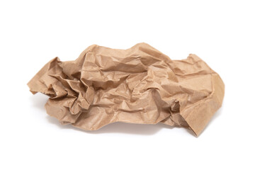 Crumpled brown paper bag on a white background.