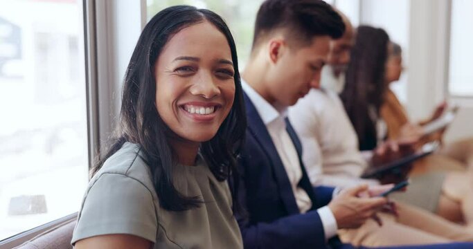 Face, interview and recruitment with a business black woman waiting in line to see human resources. Portrait, happy and smile with a female employee sitting in a row during a work hiring process