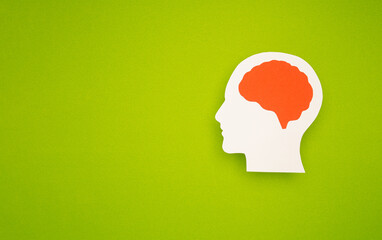 A brain shape symbol on a green background