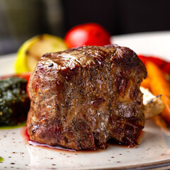 Grilled beef tenderloin steak. Filet mignon with grilled vegetables and pesto sauce