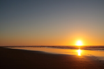 Fototapeta na wymiar Sunset at the atlantic ocean in Portugal, Nazare