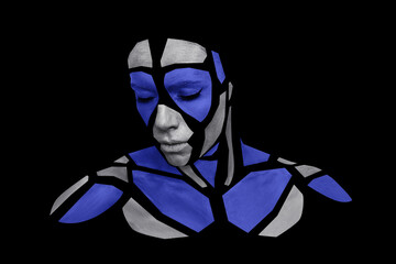 Portrait of a human with creative art makeup posing in the studio. Shape of silver gray and colorful polygons on beautiful face, neck and shoulders. Parts of face isolated on black background.