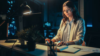 Office at Night: Female Manager Working Long Hours Alone in Creative Agency, Implementing Business...