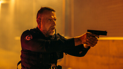Portrait of Professional Police Officer with Flashlight Aiming Gun, Orders Criminal to Stop...