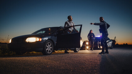 Professional Officer Ordering a Driver to Get Out of the Vehicle and Put His Hands on the Hood of...