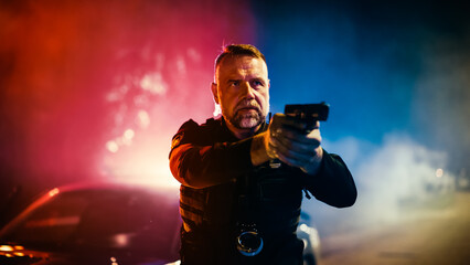 Portrait of Professional Caucasian Policeman Firmly Holding a Gun and Pointing it. Officer of the...