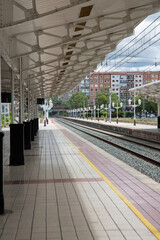 Railway Platform in Station with Tracks