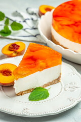 cheesecake with peache jelly. Restaurant menu, dieting, cookbook recipe. vertical image. top view. place for text