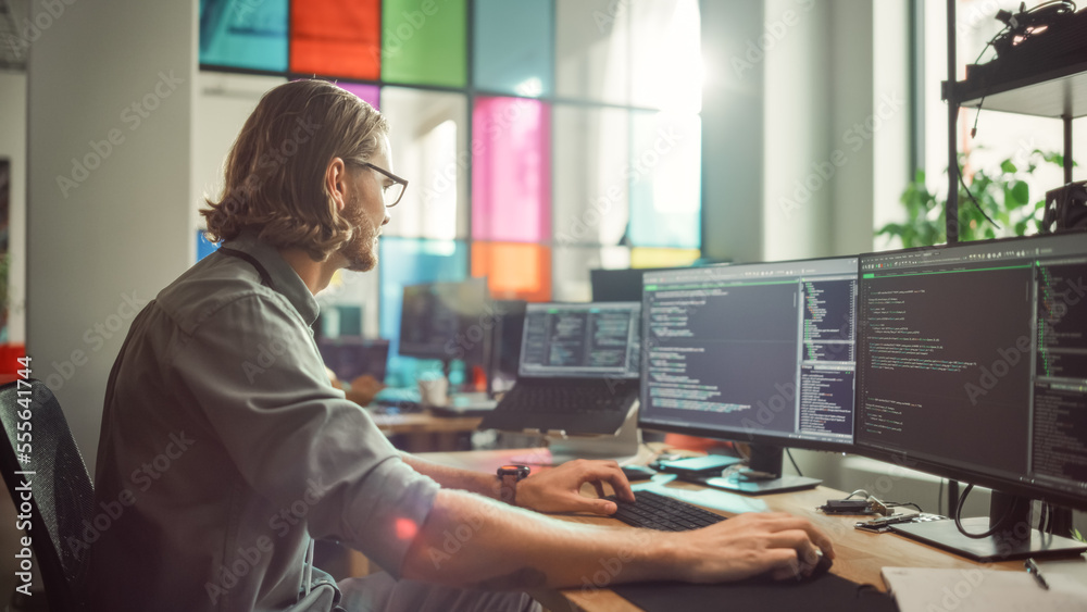 Poster Professional Male Programmer Writing Code on Desktop Computer With Multiple Displays in Stylish Office. Caucasian Man Does Data Scraping For Artificial Intelligence Innovative Start-Up.