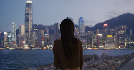 Woman look at the city scenery view at night