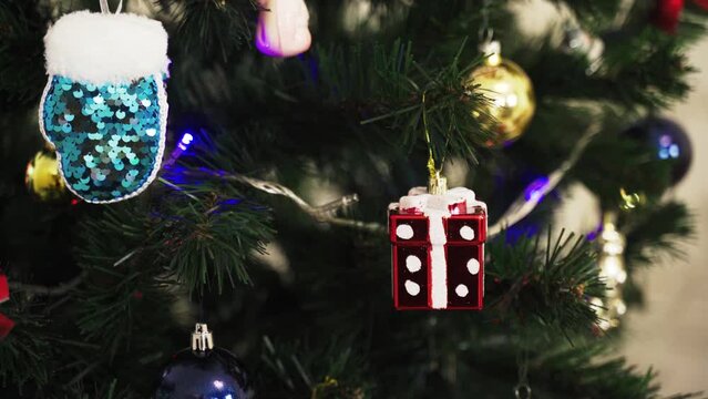 Background image of a Christmas tree decorated with toys. Close-up.