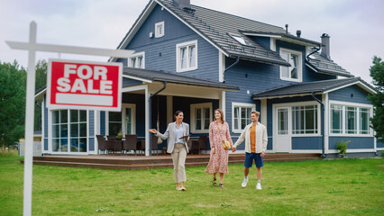 Realtor Meeting a Beautiful Successful Couple in Front of a Modern Big House That is For Sale. Real Estate Agent Selling or Renting Out a New Home to a Young Family. For Sale Sign on Front Lawn.
