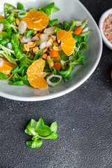mandarin salad citrus green leaves bio product fresh healthy meal food snack on the table copy space food background rustic top view 