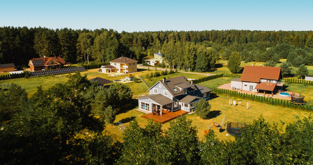 Aerial View of an American Style Country House on a Striking Summer Day with Blue Sky. Beautiful...