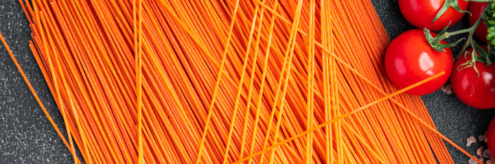 red tomato spaghetti raw pasta red dough pasta fresh healthy meal food snack on the table copy...