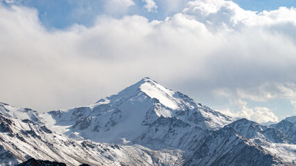 mountain peaks in the clouds. misty mountain peaks. snowy peaks