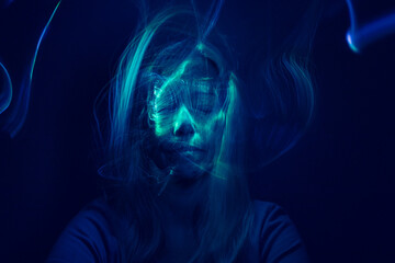 Face of a woman with online light effects. Futuristic look.
