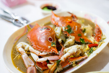 Fry crab with green onion and sauce in Taiwanese food store