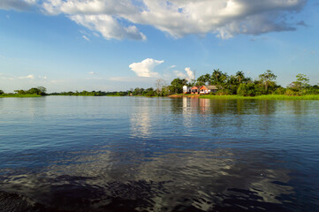 Amazing water landscape of the Amazonas river in the middle of the rain forest during a canoe excursion trip 
